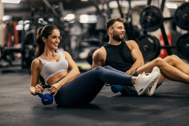 Training partners exercising together in a gym